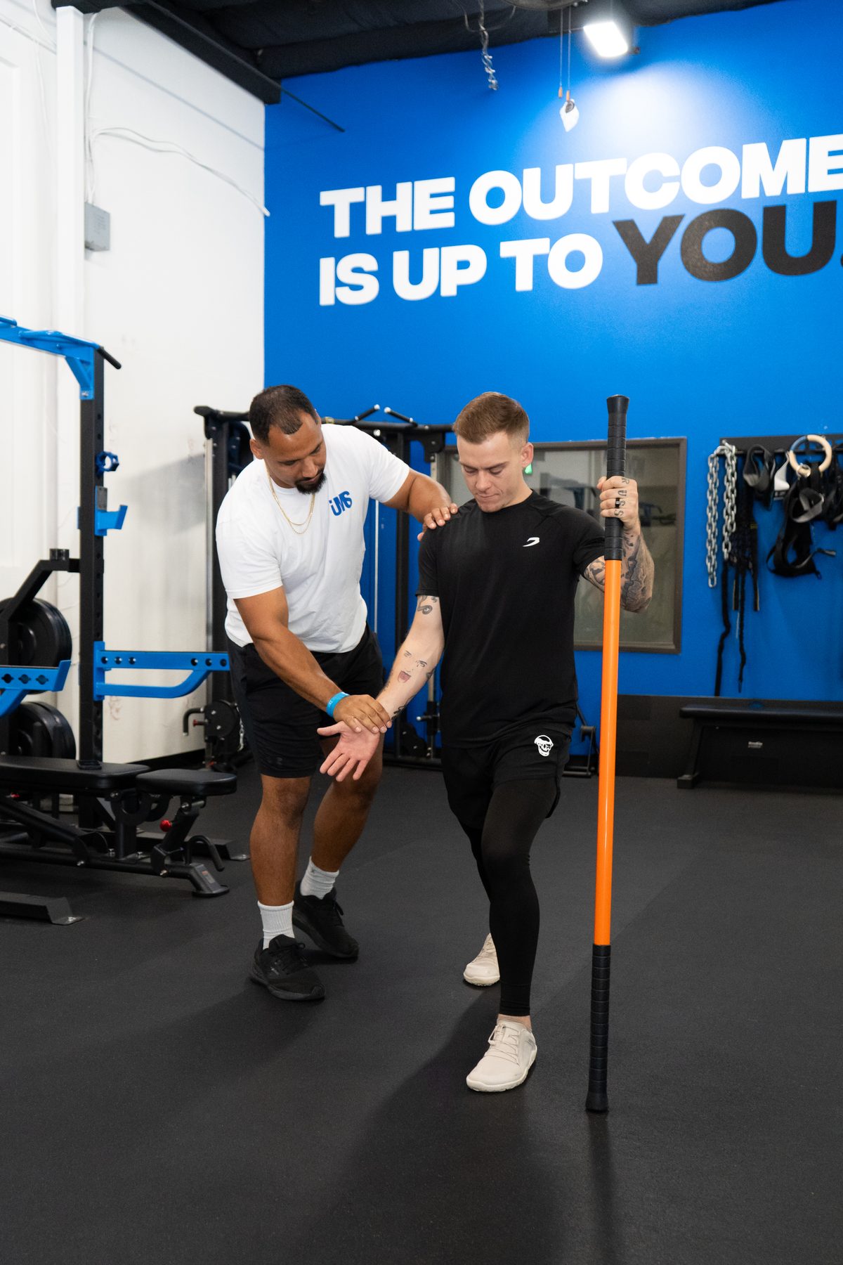 Jason coaching a client through a movement screen